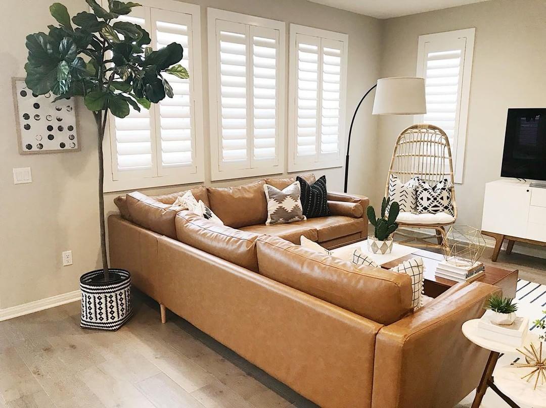 Polywood shutters have a lifetime warranty that guarantee your shutters will never crack or splinter in Jacksonville. Cozy living room with our Polywood shutters in Jacksonville.